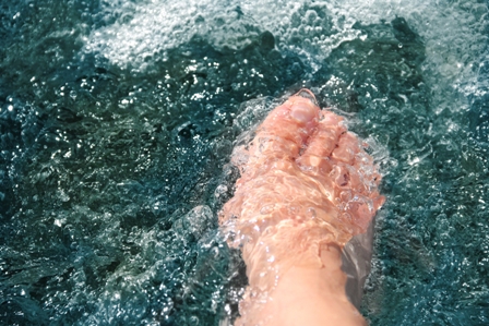 Women Foot, Refreshing And Hardening In A Mountain Brook