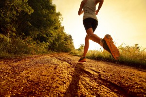 Young lady running on a rural road